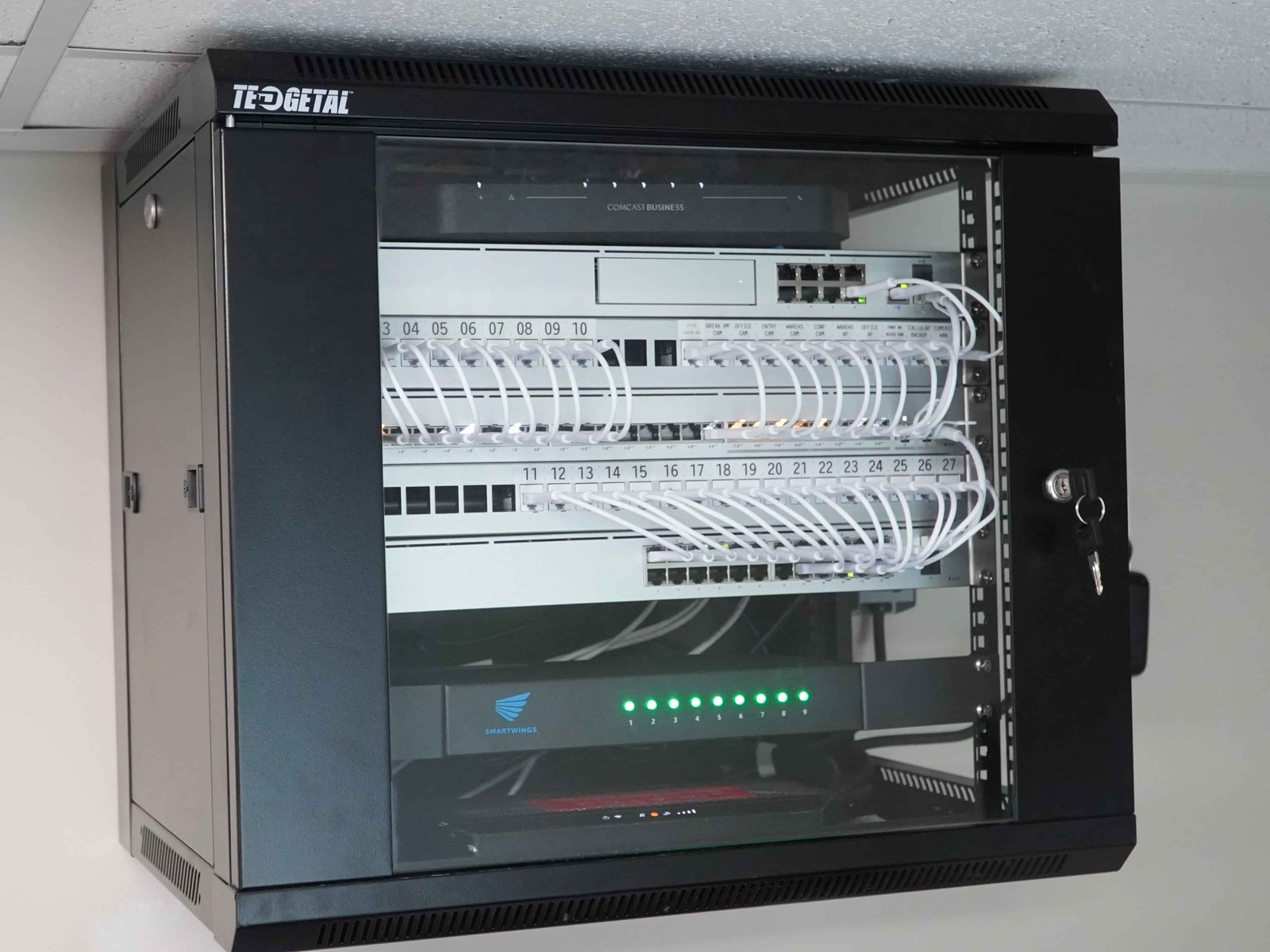 Structured cabling and network rack with Cat6 patch panel installed by Wires and Wifi for residential and commercial low-voltage infrastructure in Utah